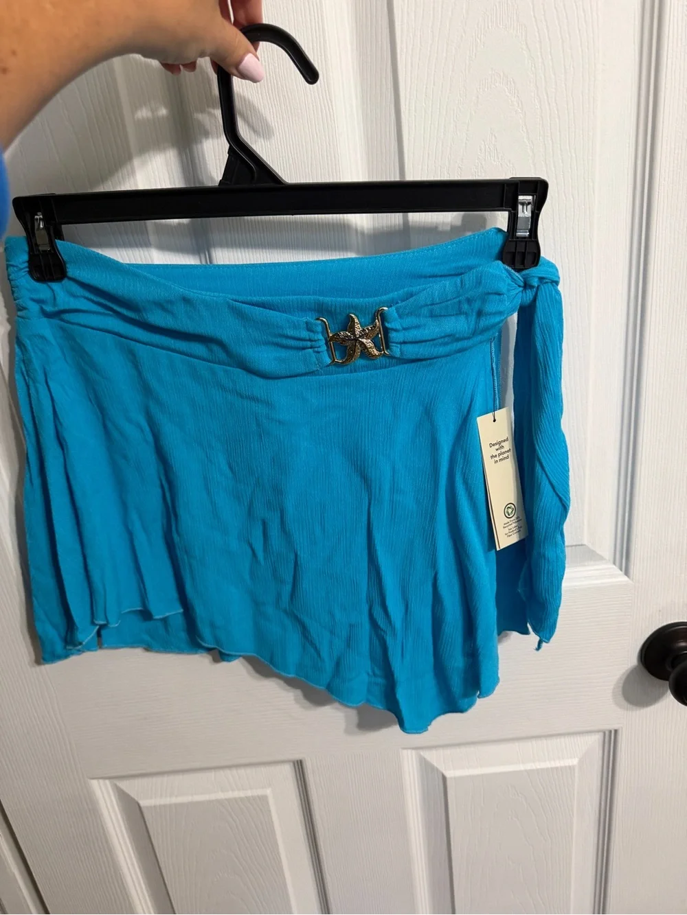 No Boundaries Turquoise Blue Two-Piece Swim Coverup with gold starfish accents.